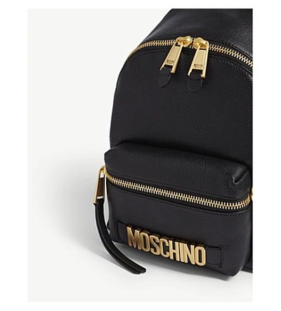 Shop Moschino 标志 皮革 背包 In Black/gold
