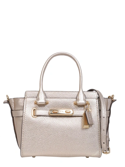 Shop Coach Swagger 21 Bag In Gold