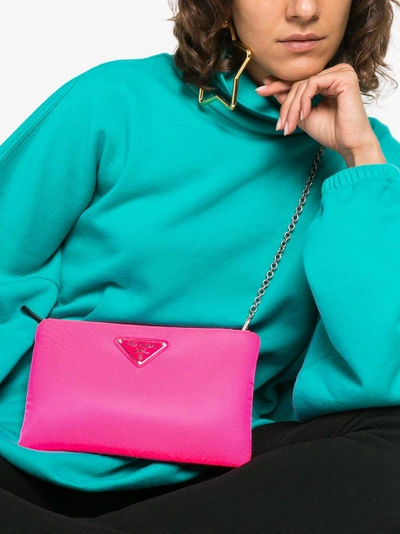Shop Prada Fluorescent Pink Clutch Bag With Chain In Pink/purple