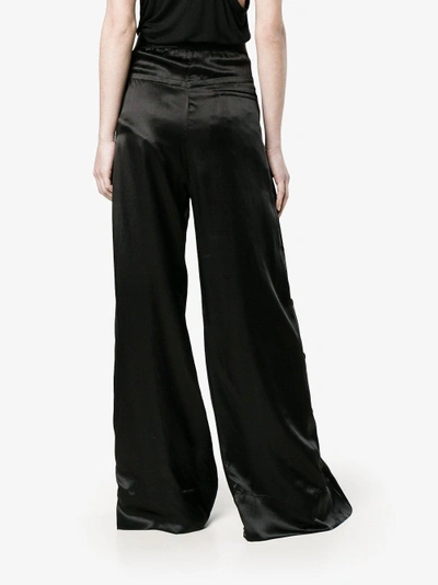 Shop Ann Demeulemeester Flared Trousers In Black