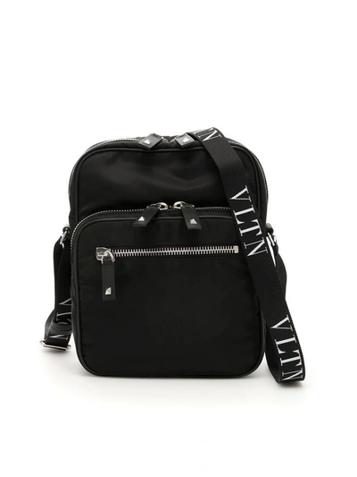 Shop Valentino Vltn Crossbody Bag In Nero Bianco