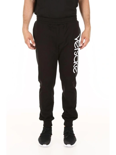 Shop Versace Sweatpants In Nero Bianco (black)