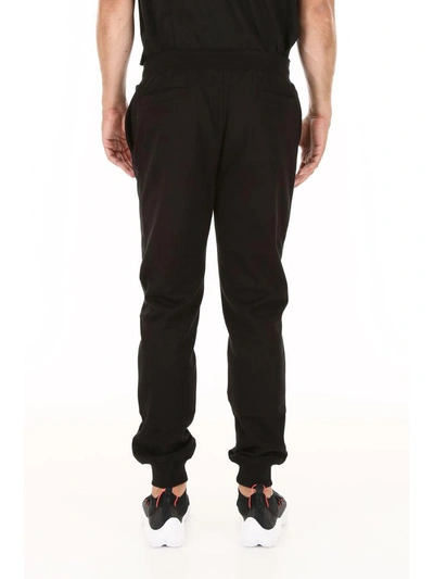 Shop Versace Sweatpants In Nero Bianco (black)