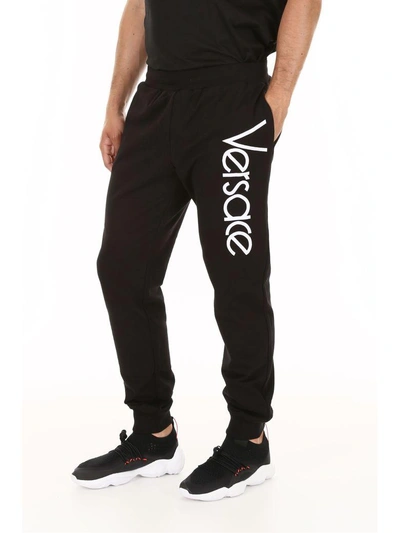 Shop Versace Sweatpants In Nero Bianco (black)