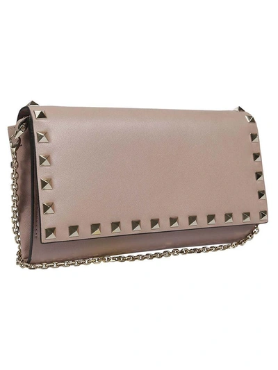 Shop Valentino Rockstud Clutch In Ppoudre