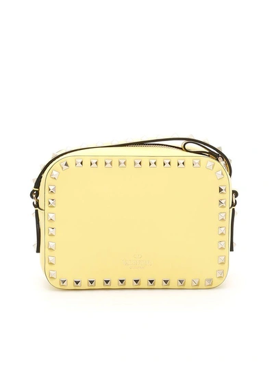 Shop Valentino Rockstud Crossbody Bag In Jonquille