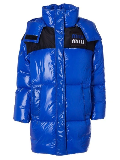 Shop Miu Miu Long Quilted Long Logo Patch Padded Jacket In Bluette