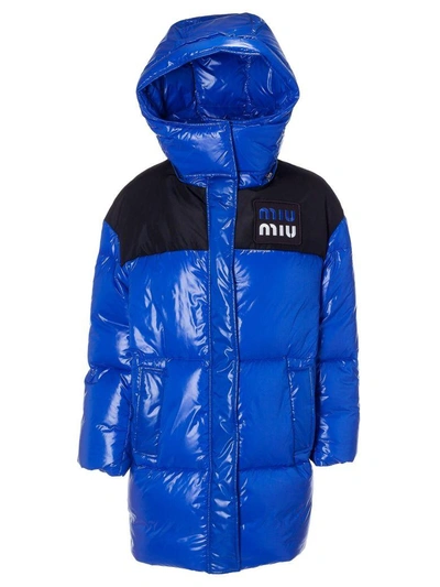 Shop Miu Miu Long Quilted Long Logo Patch Padded Jacket In Bluette