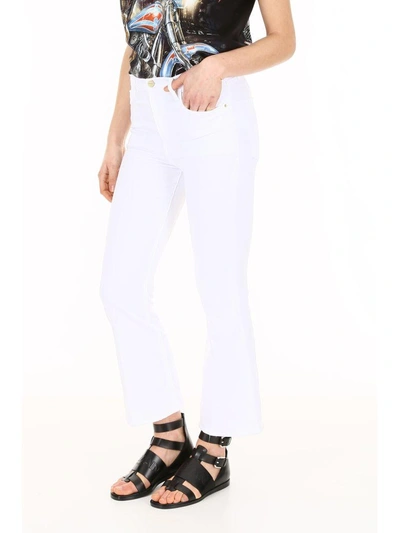 Shop Frame Le Crop Flare Jeans In Blanc (white)