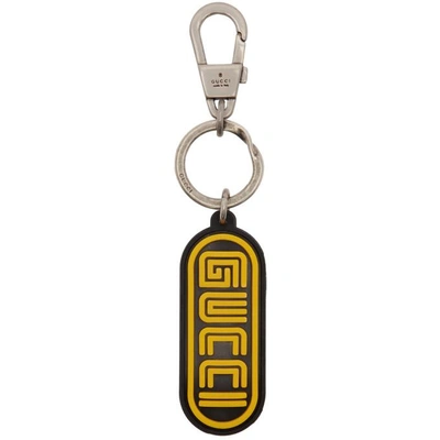 Shop Gucci Black And Yellow Rubber Logo Keychain In 8878 Bk/ylw