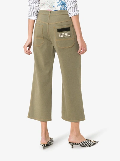 Shop Miu Miu Mid Rise Studded Cropped Wide-leg Jeans In Green