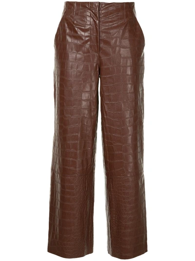 Shop Nanushka Crocodile Embossed Faux Leather Trousers - Brown