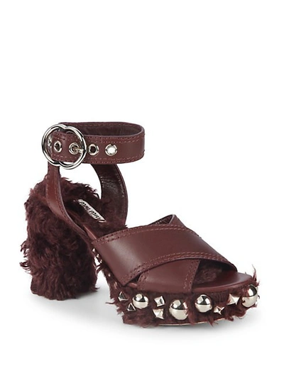 Shop Miu Miu Studded Faux Shearling And Leather Ankle-strap Sandals In Bordeaux