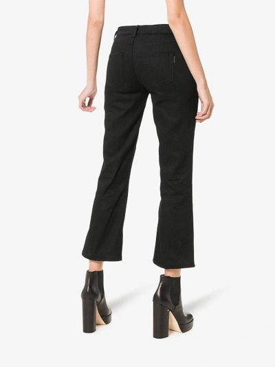 Shop Saint Laurent Skinny Flared Cropped Jeans In Black