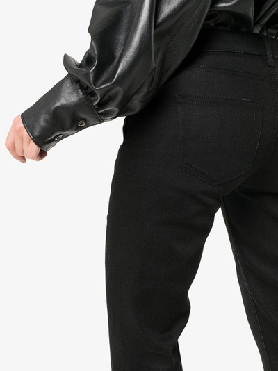 Shop Saint Laurent Skinny Flared Cropped Jeans In Black