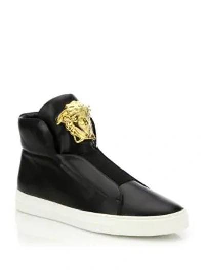 Shop Versace First Idol Smooth Leather Slip-on Sneakers In Black-gold