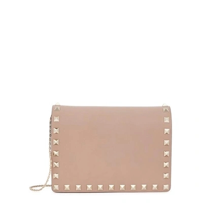 Shop Valentino Rockstud Blush Leather Clutch In Nude