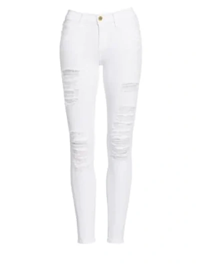 Shop Frame Le Color Mid-rise Skinny Distressed Jeans In White