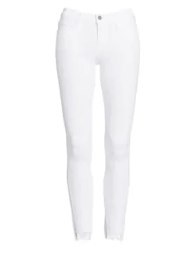 Shop Frame Le Skinny De Jeanne Step-hem Jeans In White
