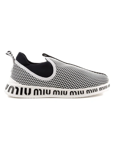 Shop Miu Miu Logo Embossed Slip-on Sneakers In Nero+bianco