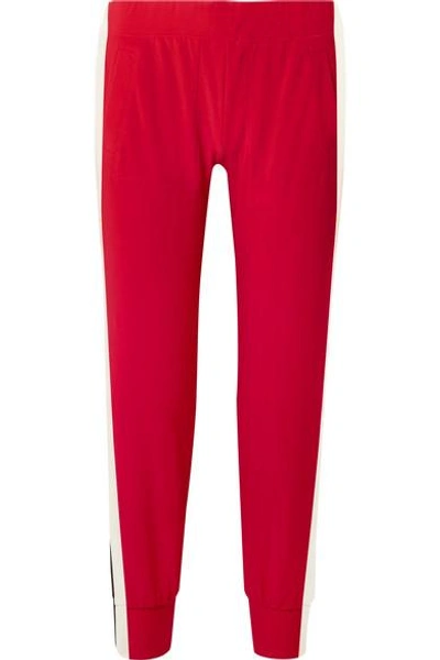 Shop Norma Kamali Striped Stretch-jersey Track Pants In Red