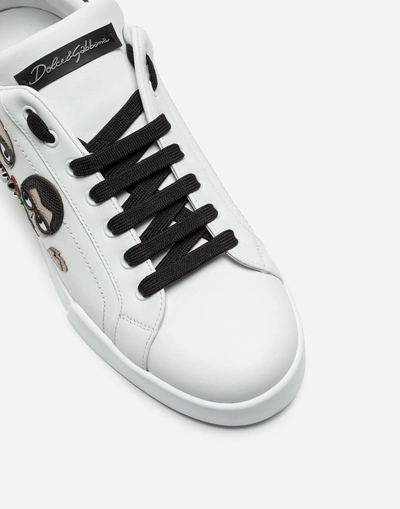 Shop Dolce & Gabbana Portofino Sneakers In Nappa Calfskin With Designers' Patches In White