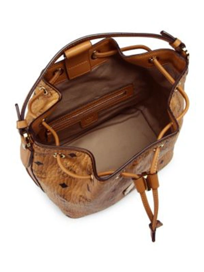Shop Mcm Essential Drawstring Visetos Bucket Bag In Cognac
