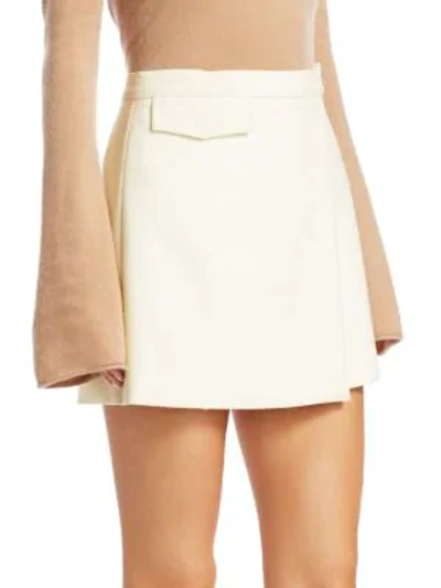 Shop Theory Snap Wrap Mini Skirt In Ivory