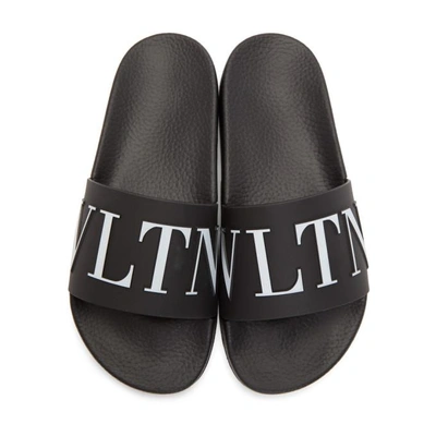 Shop Valentino Black  Garavani 'vltn' Slides