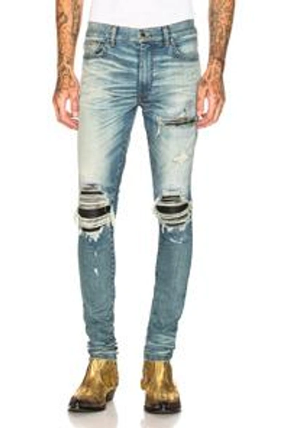 Shop Amiri Mx1 Leather Patch Skinny Jeans In Blue. In Classic Indigo & Black