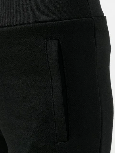 Shop Moncler Tapered Track Pants In Black