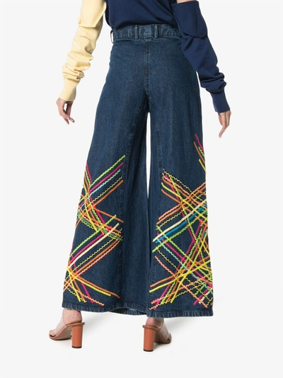 Shop All Things Mochi Brianna Embroidered Flared Jeans In Blue