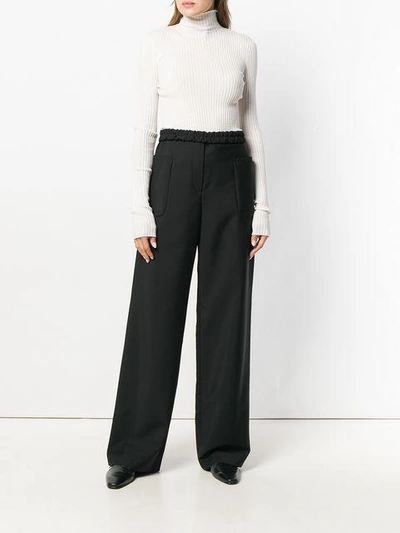 Shop Jil Sander High-waisted Trousers - Black