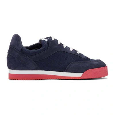 COMME DES GARCONS SHIRT 深蓝色红色搭配的 SPALWART 版 PITCH 运动鞋