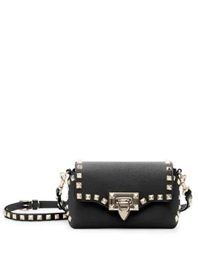 Shop Valentino Mini Rockstud Leather Crossbody Bag In Black