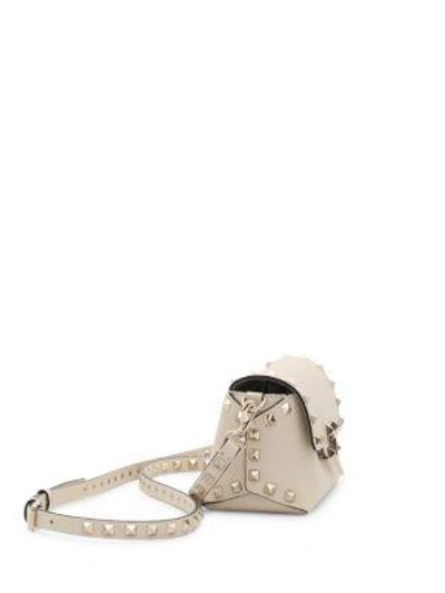 Shop Valentino Mini Rockstud Leather Crossbody Bag In Poudre