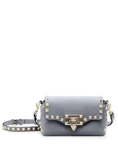 Shop Valentino Mini Rockstud Leather Crossbody Bag In Grey