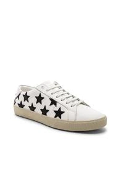 Shop Saint Laurent Leather Sl/06 Low-top Star Sneakers In Optic White & Black & Silver