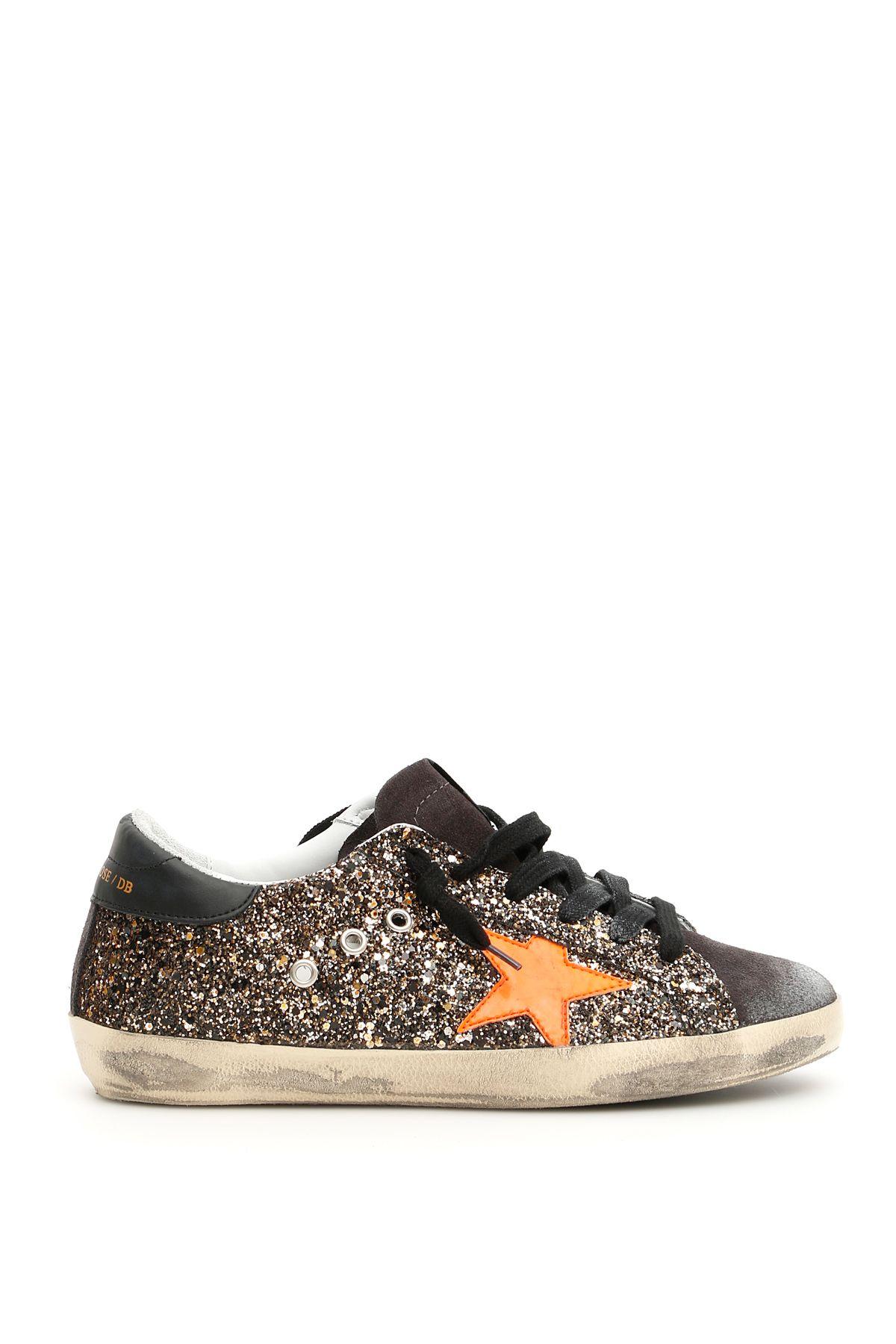 golden goose with black glitter star