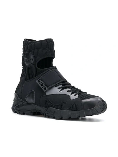 Shop Versace Cutout Sneakers In Black