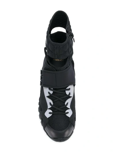 Shop Versace Cutout Sneakers In Black