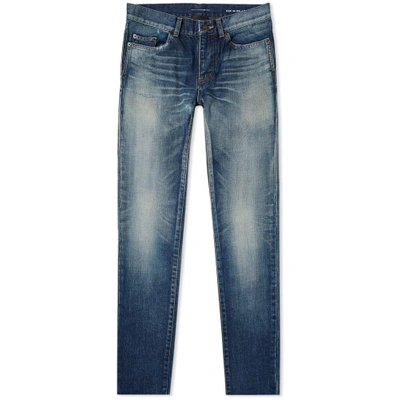 Shop Saint Laurent Trashed Distressed Skinny Jean In Blue