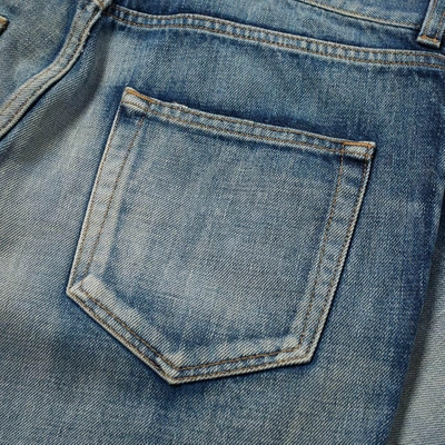 Shop Saint Laurent Trashed Distressed Skinny Jean In Blue