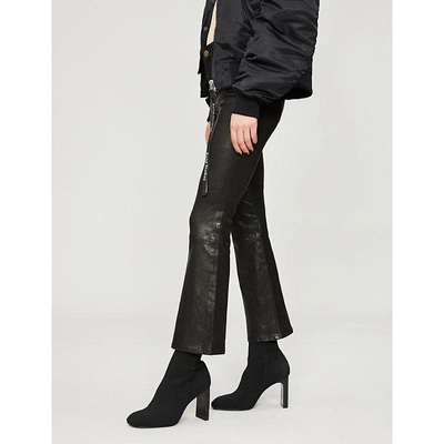 Shop Frame Le Crop Mini Boot Flared High-rise Leather Jeans In Washed Black