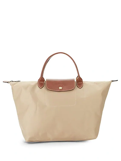 Shop Longchamp Medium Le Pliage Top Handle Bag In Beige