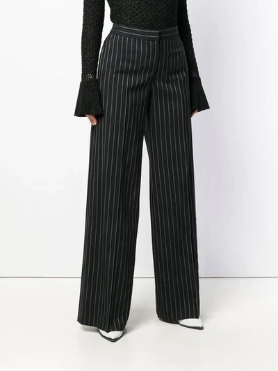 Shop Alexander Mcqueen Pinstripe Palazzo Trousers In Black