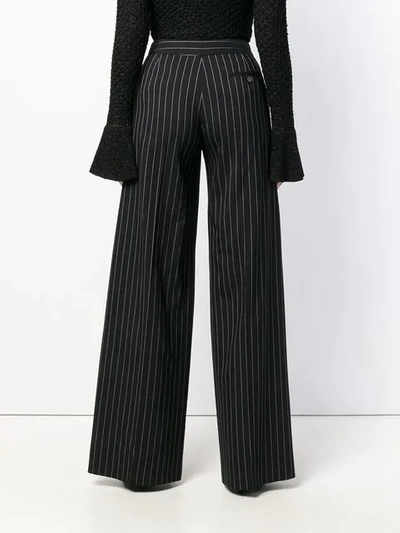 Shop Alexander Mcqueen Pinstripe Palazzo Trousers In Black