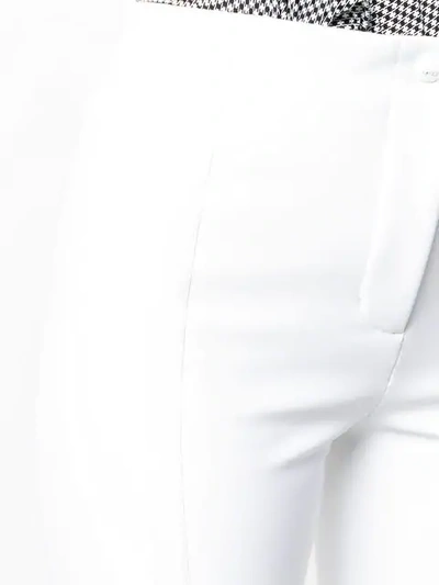 Shop Fendi High-waisted Slim Trousers In White