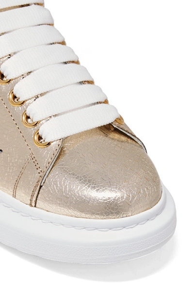 Shop Alexander Mcqueen Metallic Cracked-leather Exaggerated-sole Sneakers In Gold