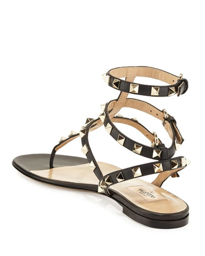 Shop Valentino Rockstud Flat Thong Sandals, Black